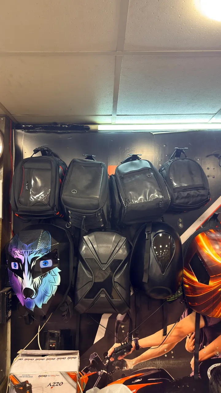 Tank bags and motorcycle luggage hanging at Speed World