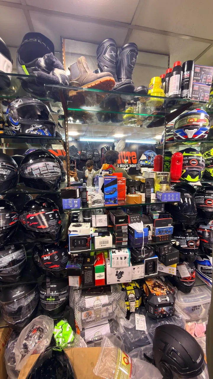 Accessories shelf with lights, gadgets and parts at Speed World