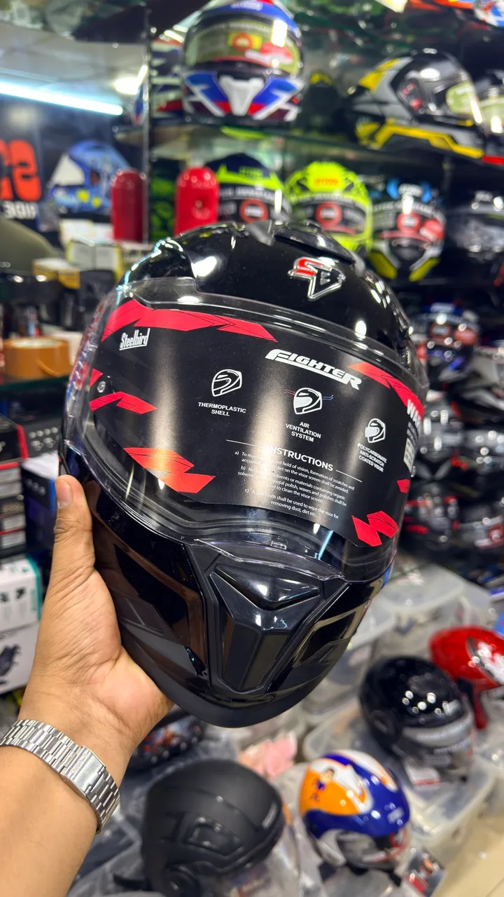 A full-face helmet held up at Speed World