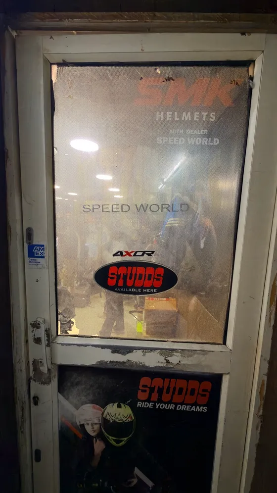 Speed World shop entrance with SMK, Studds and Axor dealer decals