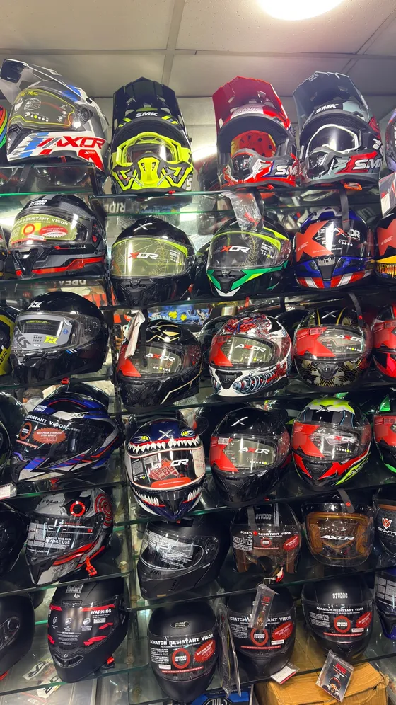 Rows of MT and SMK helmets at Speed World